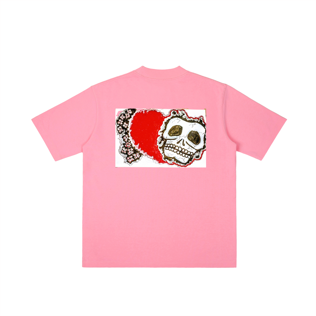 Pink t-shirt with a skull and red heart design on a white background
